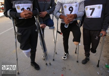 Warga Palestina berkebutuhan khusus berpartisipasi dalam lari maraton di Gaza Barat